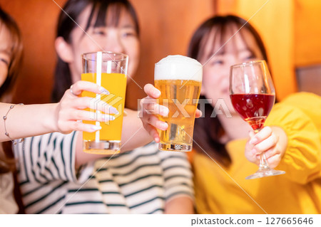 Women's party: Women toasting with various drinks 127665646