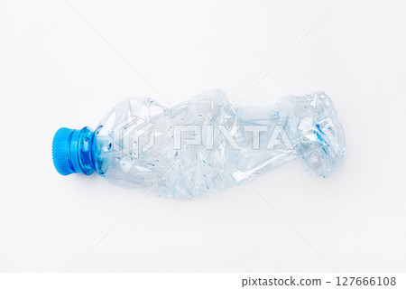 Crumpled empty plastic bottle on a white background Crumpled empty plastic bottle on a white background 127666108