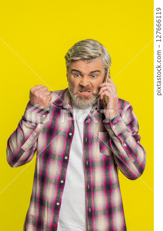 Mature man talk phone call frustration, irritated gesture, conflict mood, negative emotion outburst Mature man talk phone call frustration, irritated gesture, conflict mood, negative emotion outburst 127666119