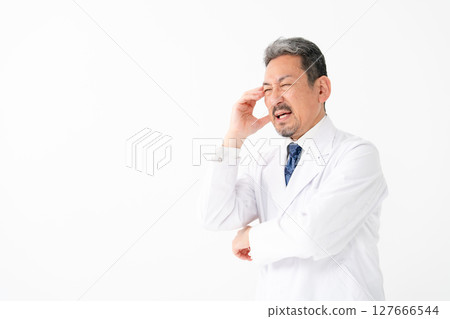 Portrait of a man in a white coat, worried 127666544