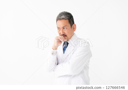 Portrait of a man in a white coat, worried Portrait of a man in a white coat, worried 127666546