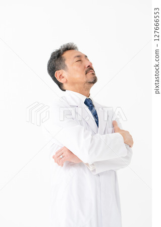 Portrait of a man in a white coat, worried Portrait of a man in a white coat, worried 127666553
