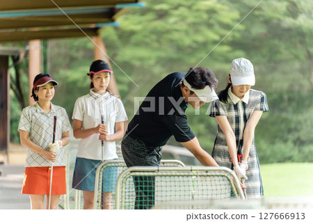 Teachers and students who play golf school, golf lessons, golf classes Teachers and students who play golf school, golf lessons, golf classes 127666913