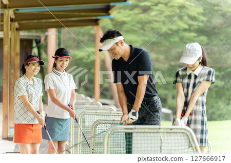 Teachers and students who play golf school, golf lessons, golf classes Teachers and students who play golf school, golf lessons, golf classes 127666917