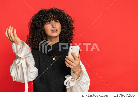 Upset sad woman use smartphone play game loses loss fail unlucky news bad lottery results crisis 127667290