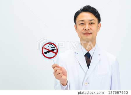 Male doctor holding a no smoking sign 127667330