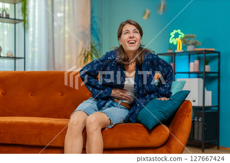 Sick ill Caucasian woman suffering from period cramps, painful stomach ache menstrual pain diarrhea Sick ill Caucasian woman suffering from period cramps, painful stomach ache menstrual pain diarrhea 127667424