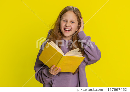 Happy child girl kid reading funny interesting fairytale story book, leisure hobby, learning, study 127667462