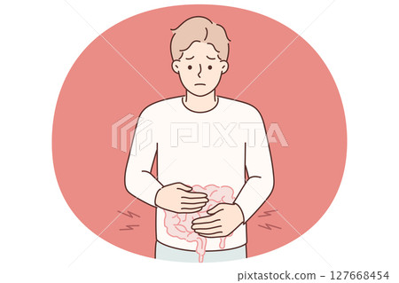 Man puts hands on stomach feeling pain in intestinal due to malnutrition or fast food poisoning 127668454