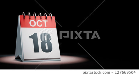October 18 Calendar Spotlighted on Black Background 127669504