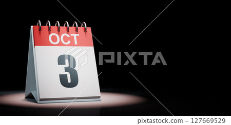 October 3 Calendar Spotlighted on Black Background 127669529