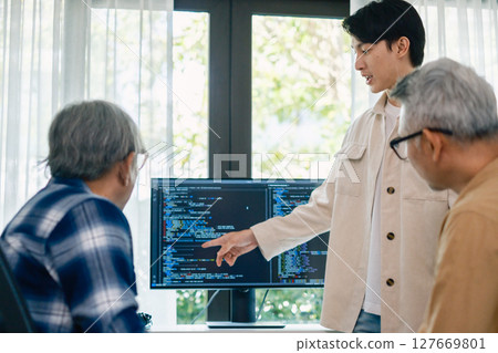 senior programmer bootcamlp,Asian young instructor guides senior learners through a programming on whiteboard, highlighting algorithm thinking and simple code exercises 127669801