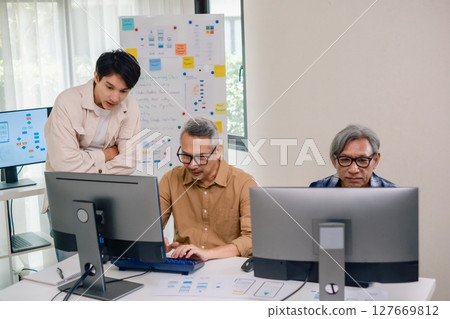 Asian Instructor Teaching Senior in Software Programming and Training Collaboration 127669812