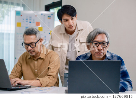 Asian Instructor Teaching Senior in Software Programming and Training Collaboration 127669815