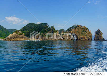 The rocky surface of the Sanriku Coast and the blue sea and sky The rocky surface of the Sanriku Coast and the blue sea and sky 127670276