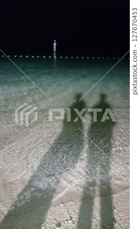 Summer in Okinawa, the blue sea at night and the two of us Summer in Okinawa, the blue sea at night and the two of us 127670453