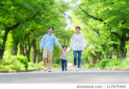 Families walking hand in hand 127670466