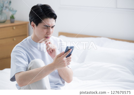 Young man who wakes up and sees disturbing emails and chats causes problems at work Young man who wakes up and sees disturbing emails and chats causes problems at work 127670575