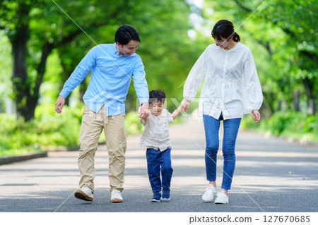 Families walking hand in hand 127670685
