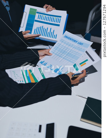 Two business people analyzing the data Two business people analyzing the data 127671294