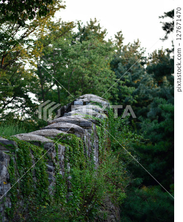 Seoul City Wall in Namsan hill park, old fortress protecting Seoul, capital of South Korea 127671470