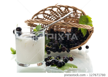 Homemade yogurt with blackcurrant on white background 127671780