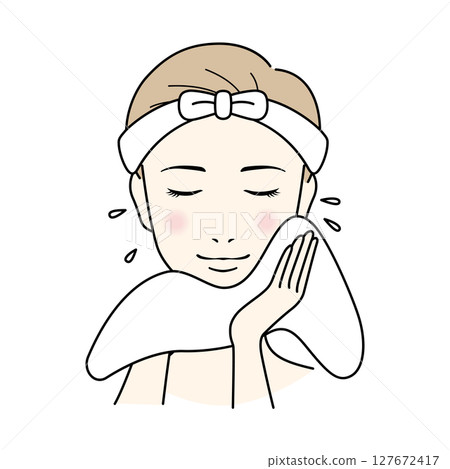 A woman with short hair doing skin care, washing her face A woman with short hair doing skin care, washing her face 127672417