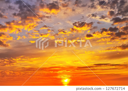 Vibrant sunset over the horizon with a colorful sky Vibrant sunset over the horizon with a colorful sky 127672714