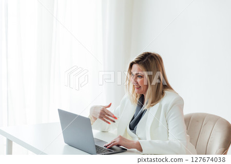 Woman in business working with laptop in office Woman in business working with laptop in office 127674038