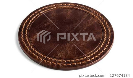 Empty brown leather label with stitching on a white background, top view, for branding and product design. 127674184