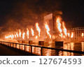 Burning flames and large roof ring 127674593
