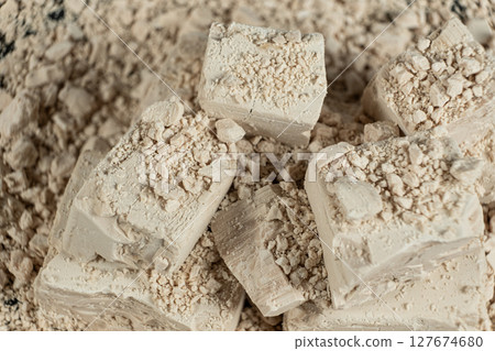 Macro texture of compressed fresh yeast cubes 127674680