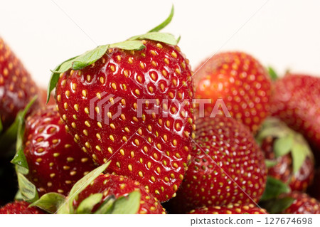 Ripe fresh whole strawberries close-up macro. 127674698