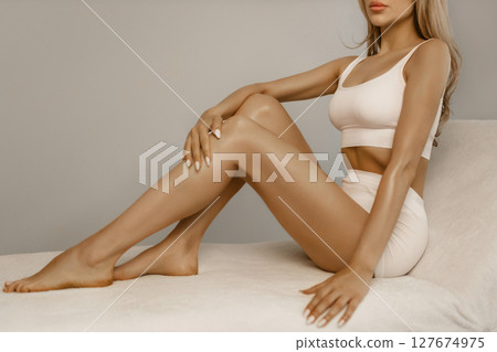 Wellness and beauty concept, beautiful slim woman in white underwear Wellness and beauty concept, beautiful slim woman in white underwear 127674975