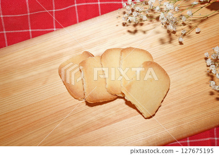 Homemade shortbread cookies on cutting board. 127675195