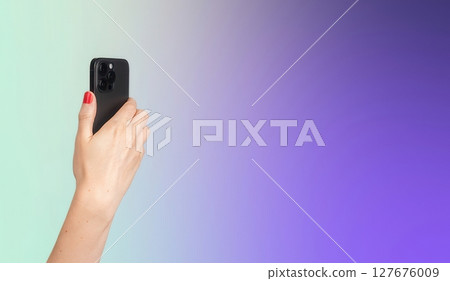 Lodz Poland June 1 2025 Hand holding smartphone. modern device used for photography, social 127676009