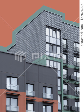 Building corner with green, coral, red, and black facade in geometric pattern. Stylized modern Building corner with green, coral, red, and black facade in geometric pattern. Stylized modern 127676026
