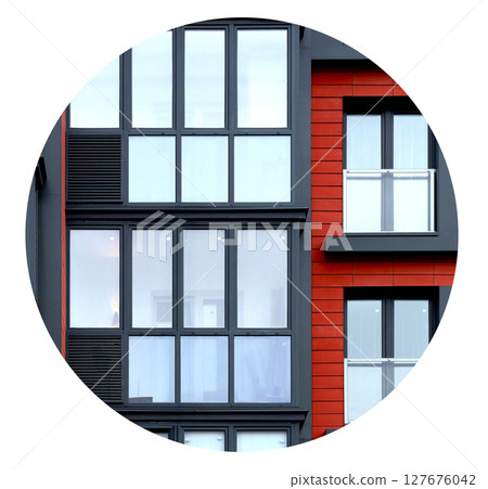 Building with circular architectural element and red glass windows. Modern apartment facade with Building with circular architectural element and red glass windows. Modern apartment facade with 127676042
