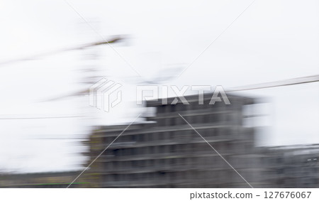 Construction site with motion blur showing crane and unfinished highrise building. Abstract dynamic Construction site with motion blur showing crane and unfinished highrise building. Abstract dynamic 127676067