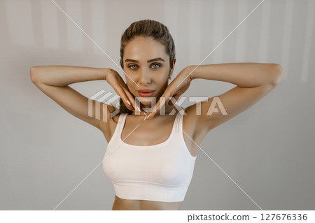 Portrait of young beautiful woman with perfect smooth skin isolated over background. Tenderness and sensuality. Concept of natural beauty, plastic surgery, cosmetology, cosmetics, skin care 127676336