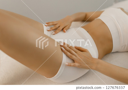 Wellness and beauty concept, beautiful slim woman in white underwear  127676337