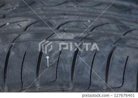 iron nail from car tire on magnesium alloy wheel after accident iron nail from car tire on magnesium alloy wheel after accident 127676401