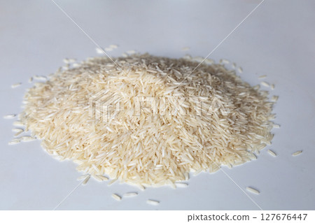 A pile of dry white rice A pile of dry white rice 127676447