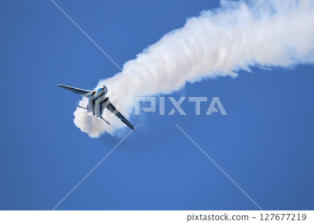 Blue Impulse flying in the blue sky 127677219