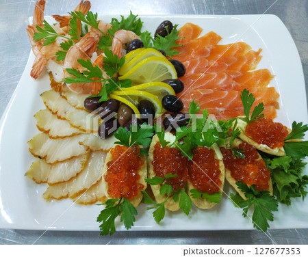salmon, butterfish, shrimp tails and tartlets with red caviar salmon, butterfish, shrimp tails and tartlets with red caviar 127677353