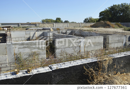 construction of the foundation of a new residential building construction of the foundation of a new residential building 127677361
