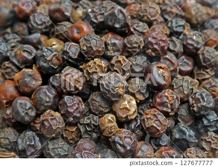 A photo of black peppercorns in full view 127677777