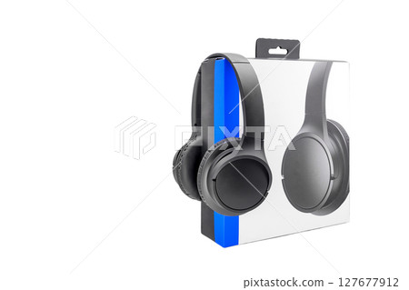 black acoustic stereo headphones on white background and cardboard box black acoustic stereo headphones on white background and cardboard box 127677912