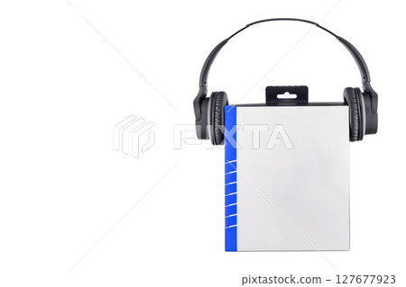 close up of black wireless stereo headphones and paper box on white background, box mockup close up of black wireless stereo headphones and paper box on white background, box mockup 127677923