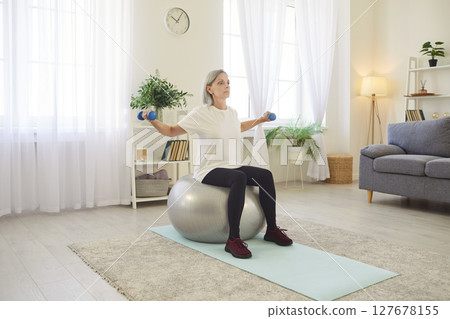 Stability ball exercise for balance, dumbbell, fitness, senior sporty woman, old yoga at home Stability ball exercise for balance, dumbbell, fitness, senior sporty woman, old yoga at home 127678155